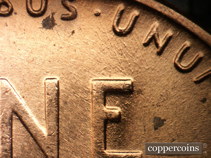 Die-stage B marker on 1957D•1DO•035 (1957 Doubled Die Obverse).