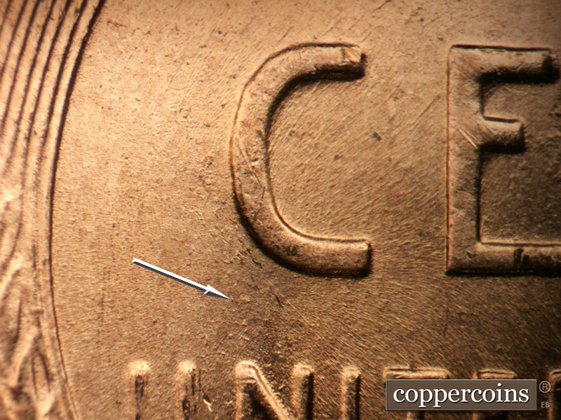 Die-stage B marker on 1957D•1DO•035 (1957 Doubled Die Obverse).