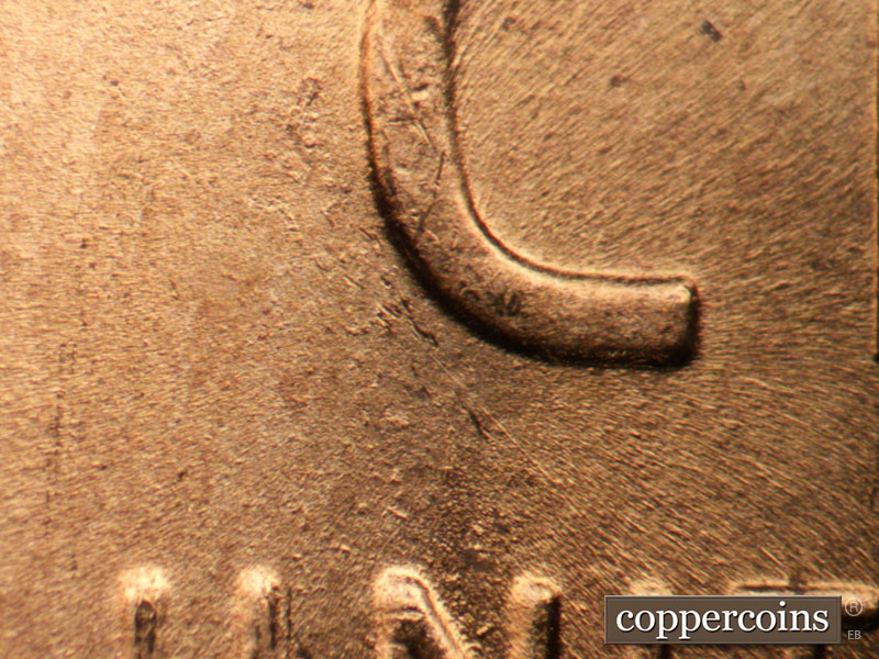 Die-stage B marker on 1957D•1DO•035 (1957 Doubled Die Obverse).
