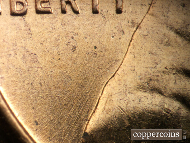 Die-stage B marker on 1957D•1DO•036 (1957 Doubled Die Obverse).