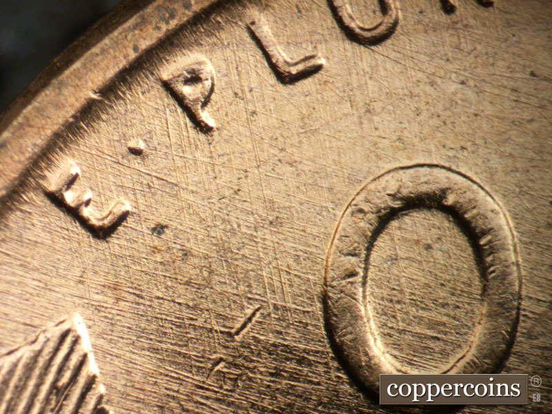 Die-stage B marker on 1957D•1DO•036 (1957 Doubled Die Obverse).