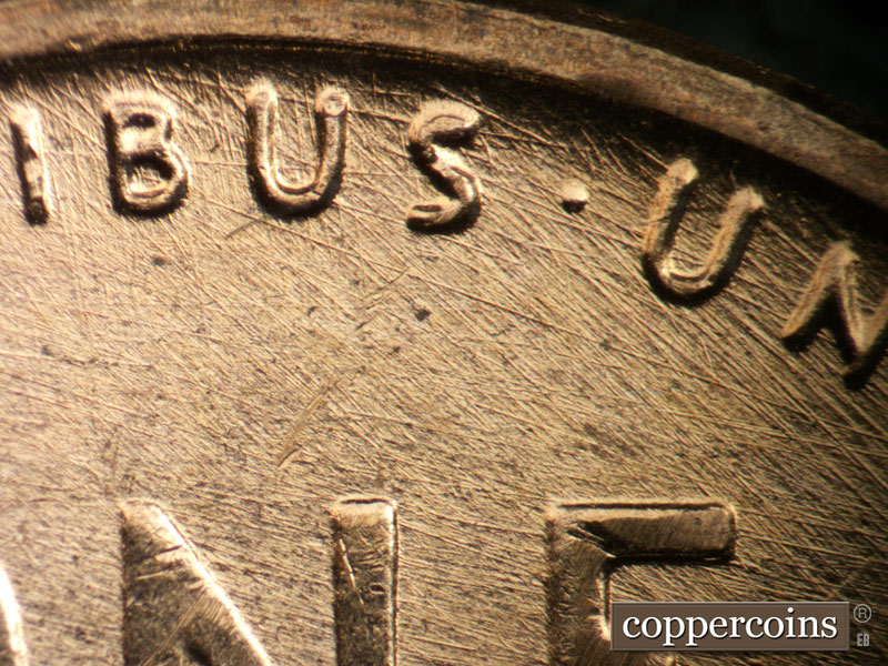 Die-stage B marker on 1957D•1DO•036 (1957 Doubled Die Obverse).