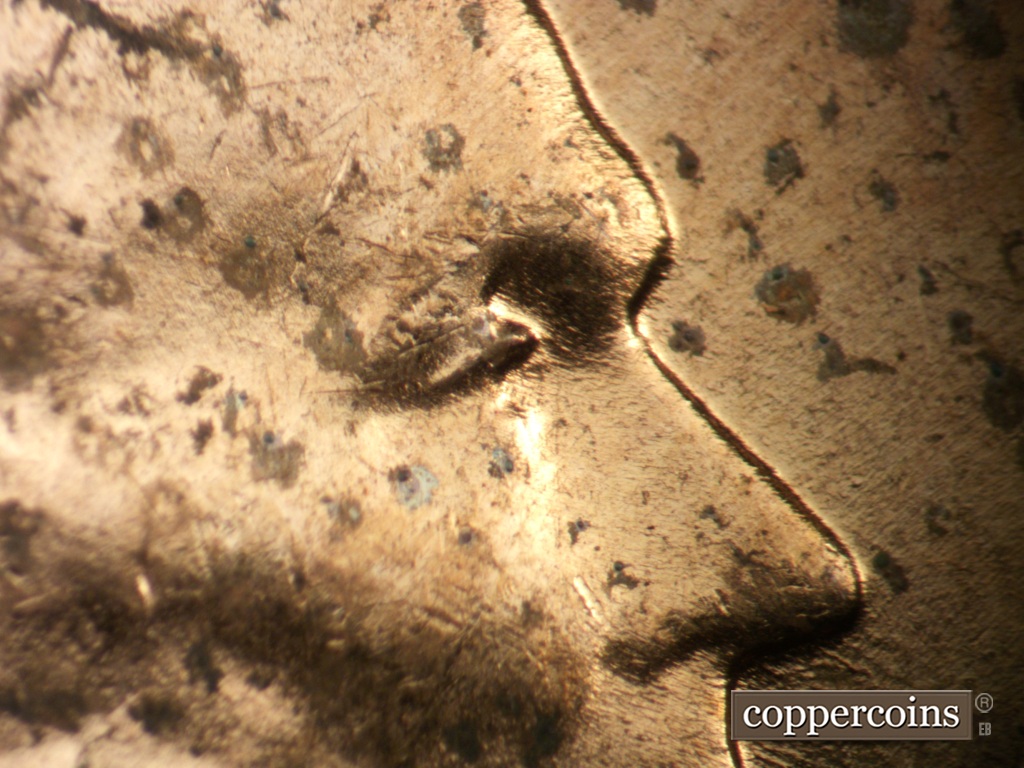 Die-stage B marker on 1957D•1DO•038 showing Extra eyelid south of primary.