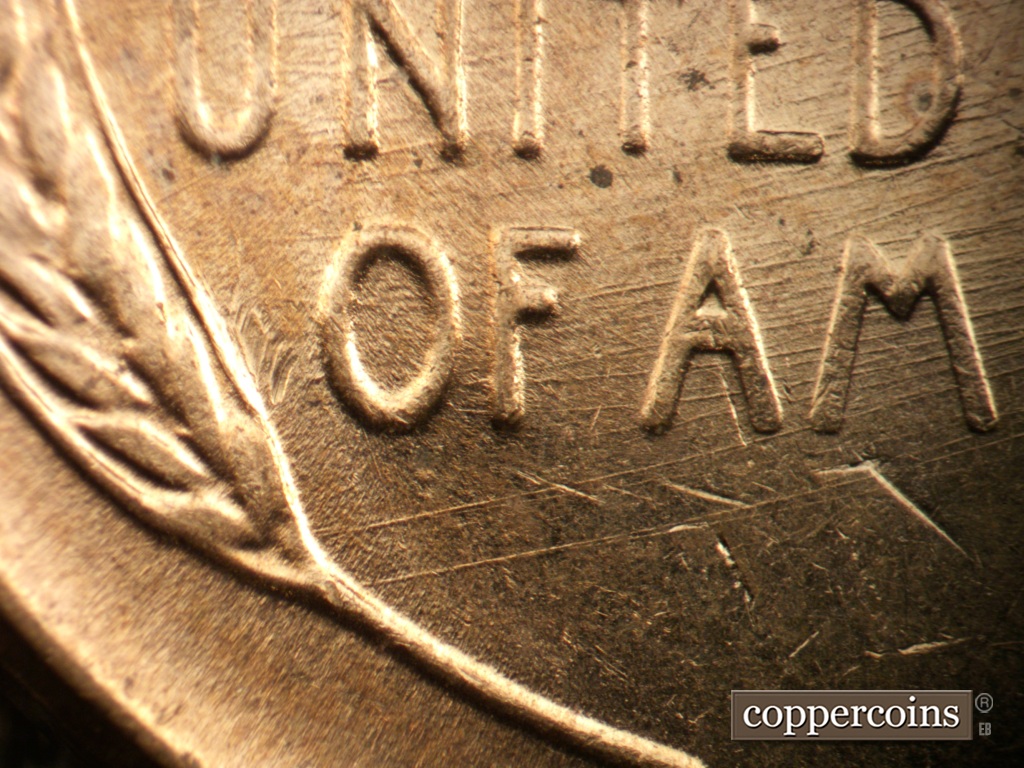 Die-stage B marker on 1957D•1DO•038 showing ENE die scratches through UNITED and OF.