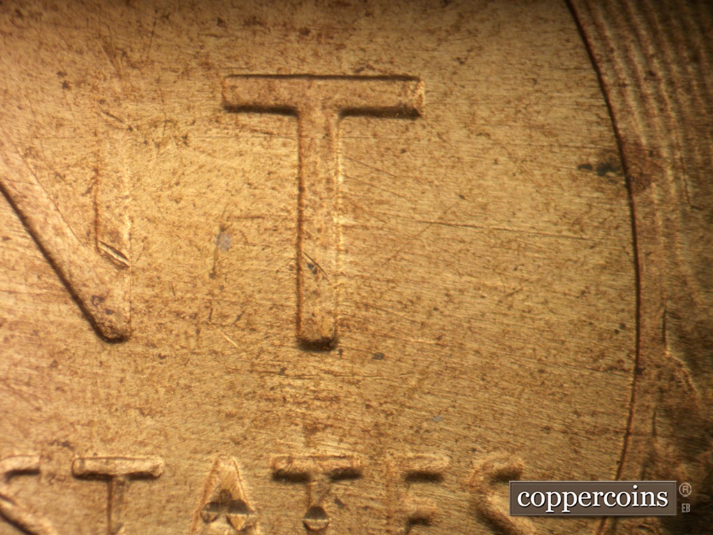 Die-stage A marker on 1957D•1DO•040 showing E/W die scratches through T in CENT.