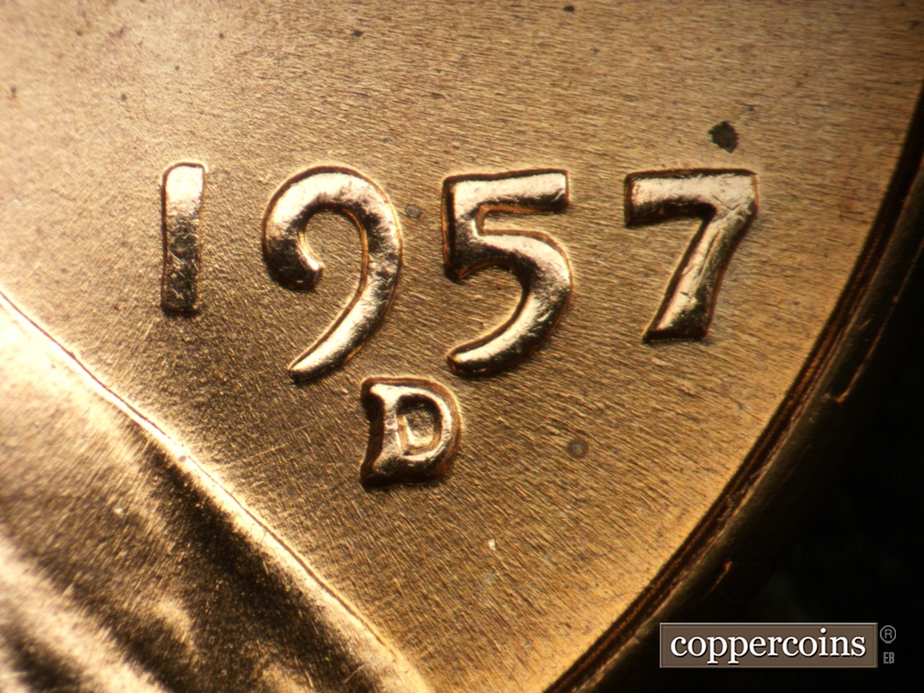 Die-stage B marker on 1957D•1DO•041 showing Date for reference. Light curved die scratches from lapel towards date.