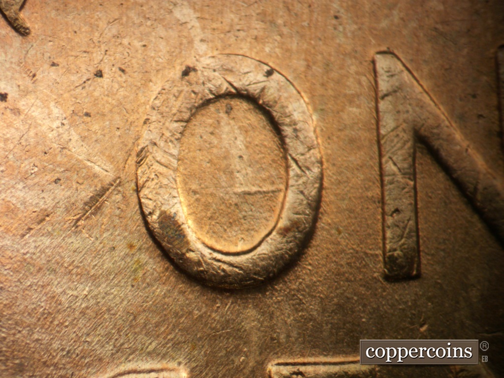 Die-stage B marker on 1957D•1DO•041 showing E/W die gouge in O in ONE.