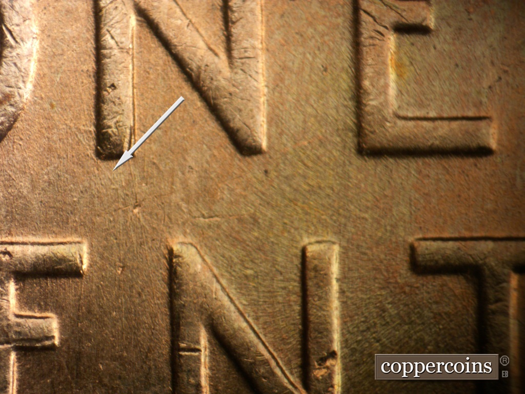 Die-stage B marker on 1957D•1DO•041 showing Light SE die scratch from N in ONE to N in CENT.