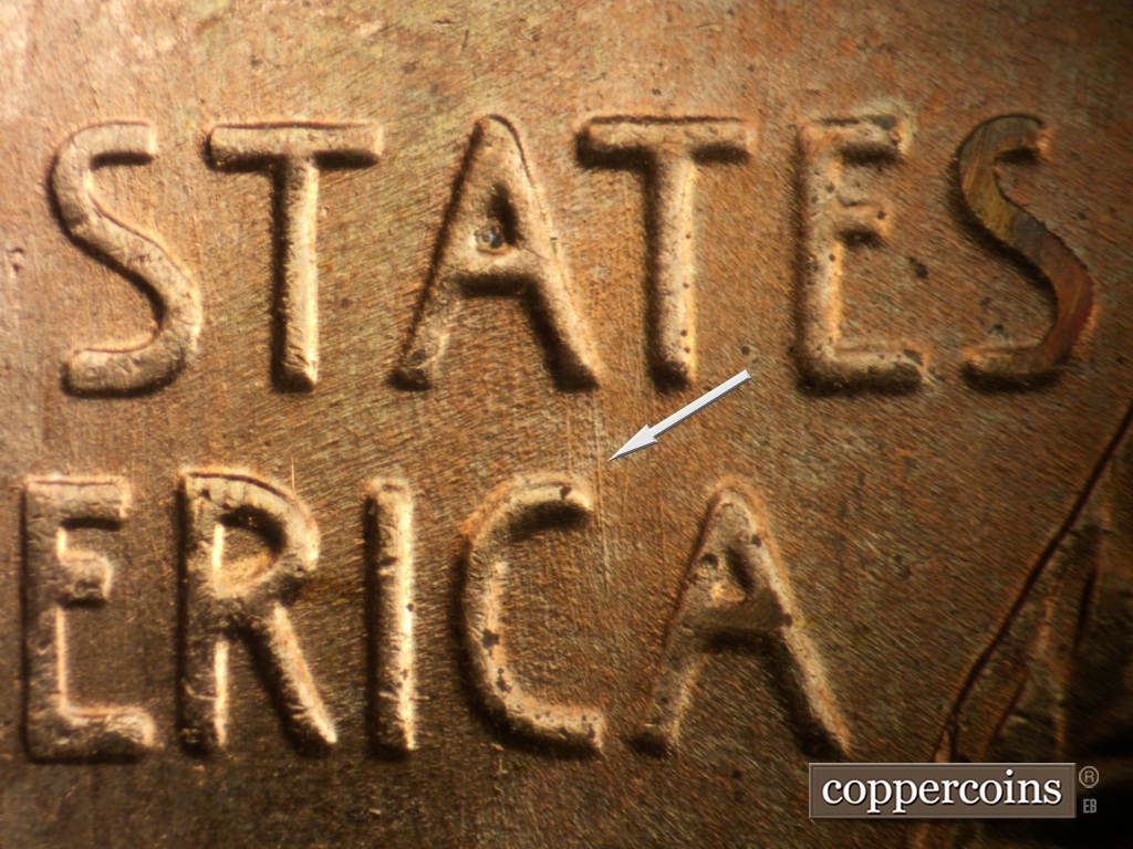 Die-stage B marker on 1957D•1DO•041 showing N/S die scratch from A in STATES to C in AMERICA.