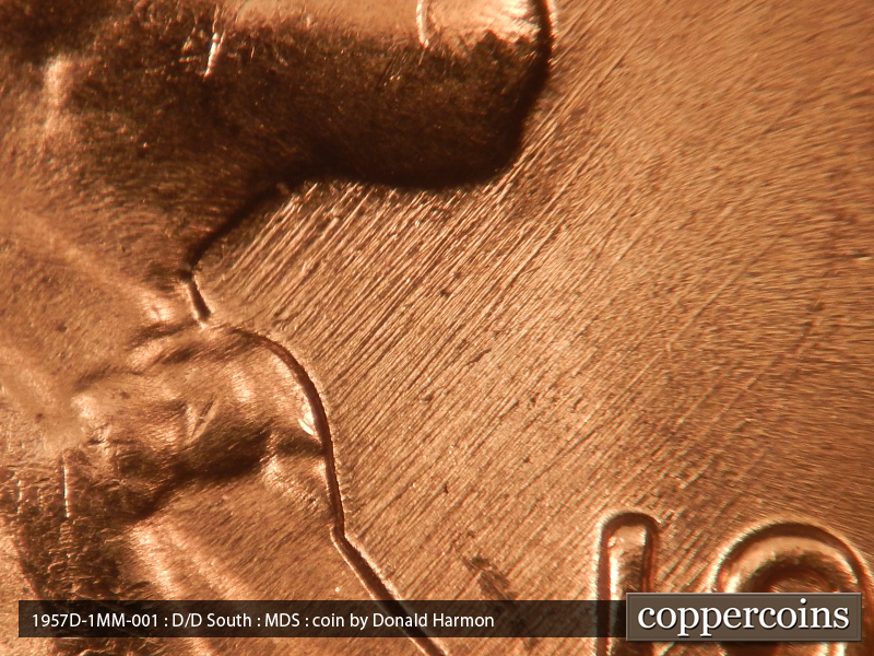 Die-stage B marker on 1957D•1MM•001 (1957 Repunched Mint Mark).