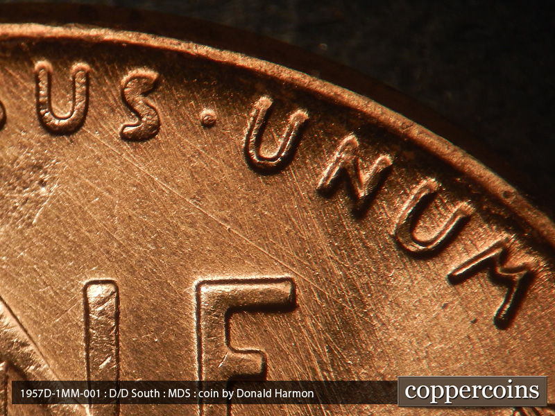 Die-stage B marker on 1957D•1MM•001 (1957 Repunched Mint Mark).