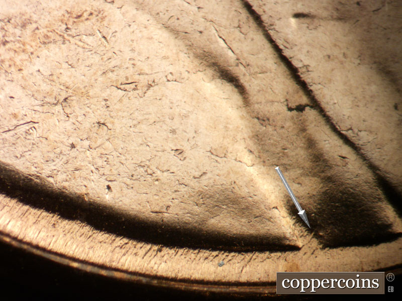 Die-stage C marker on 1957D•1MM•001 (1957 Repunched Mint Mark).
