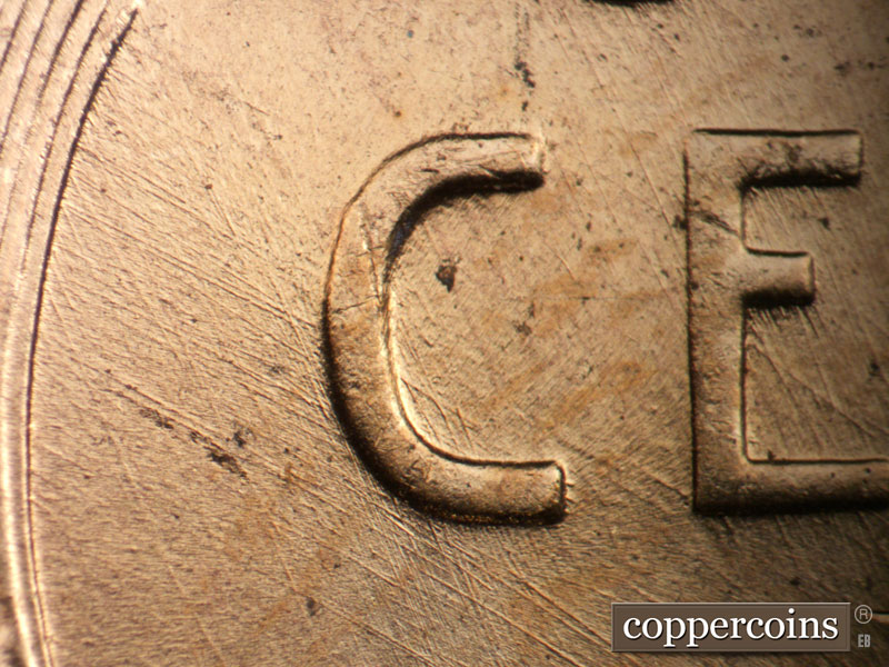 Die-stage C marker on 1957D•1MM•001 (1957 Repunched Mint Mark).