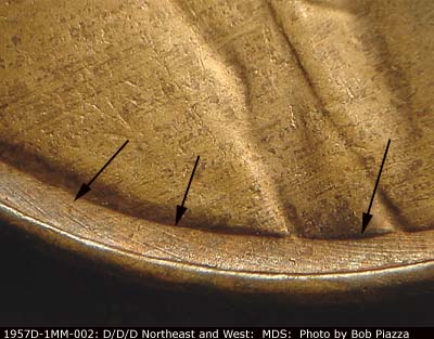Die-stage B marker on 1957D•1MM•002 (1957 Repunched Mint Mark).