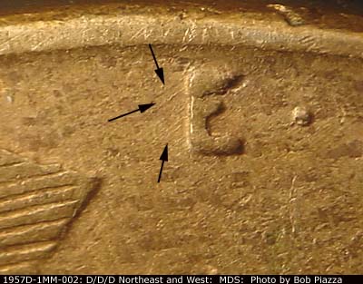 Die-stage B marker on 1957D•1MM•002 (1957 Repunched Mint Mark).
