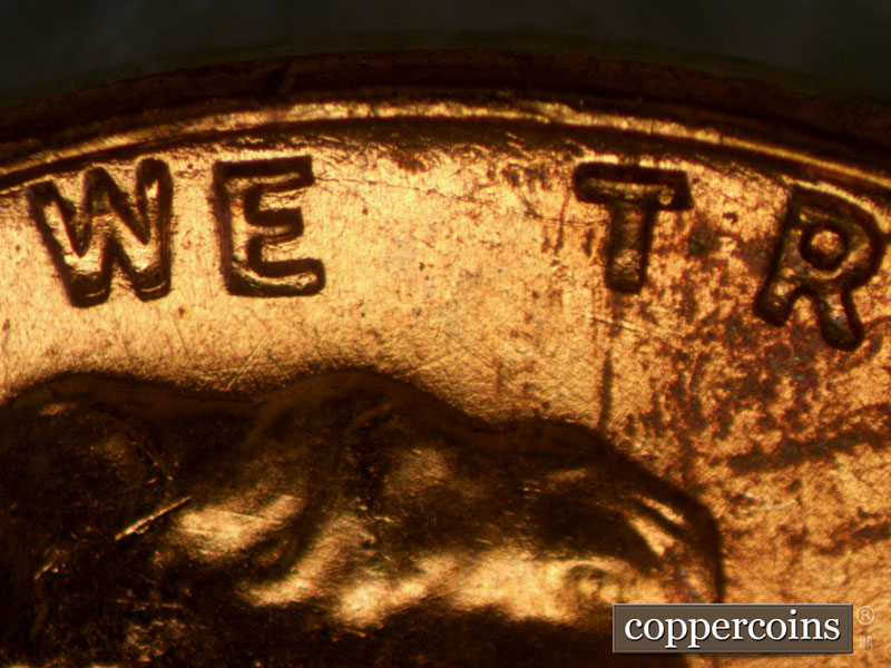 Die-stage A marker on 1957D•1MM•003 (1957 Repunched Mint Mark).