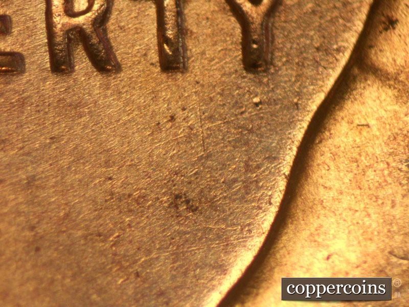 Die-stage A marker on 1957D•1MM•003 (1957 Repunched Mint Mark).