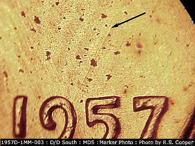 Die-stage B marker on 1957D•1MM•003 (1957 Repunched Mint Mark).