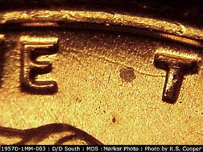 Die-stage B marker on 1957D•1MM•003 (1957 Repunched Mint Mark).