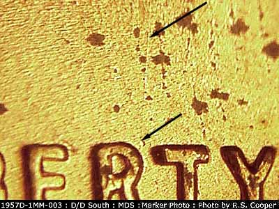 Die-stage B marker on 1957D•1MM•003 (1957 Repunched Mint Mark).