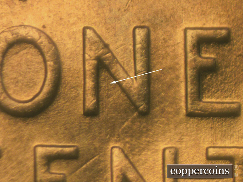 Die-stage A marker on 1957D•1MM•005 (1957 Repunched Mint Mark).