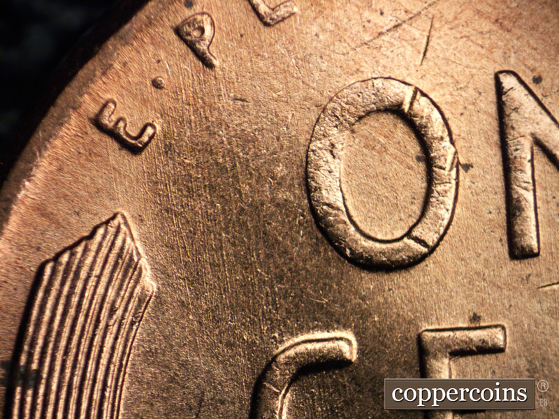 Die-stage B marker on 1957D•1MM•005 (1957 Repunched Mint Mark).