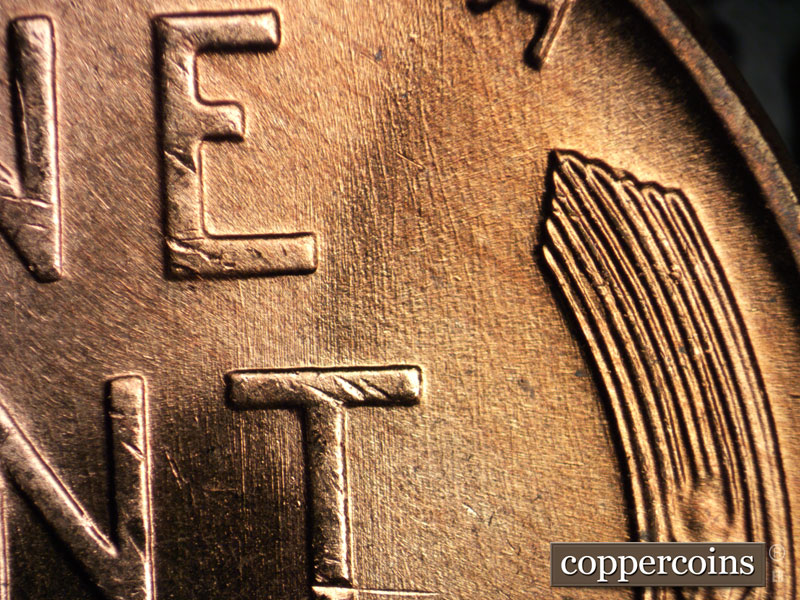 Die-stage B marker on 1957D•1MM•005 (1957 Repunched Mint Mark).