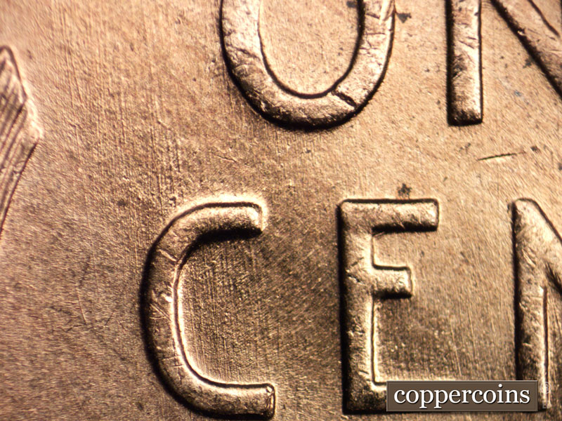 Die-stage B marker on 1957D•1MM•005 (1957 Repunched Mint Mark).