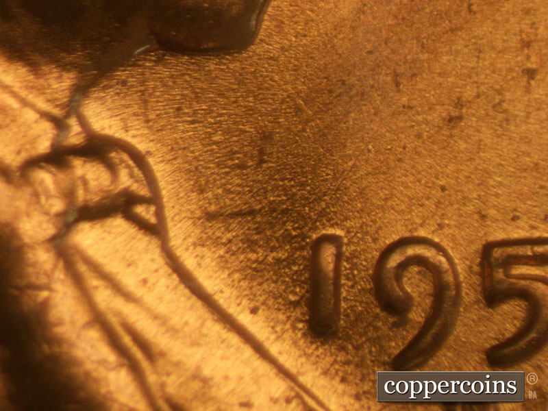 Die-stage B marker on 1957D•1MM•006 (1957 Repunched Mint Mark).
