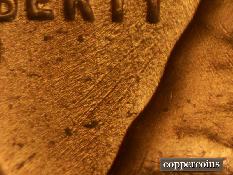 Die-stage B marker on 1957D•1MM•006 (1957 Repunched Mint Mark).