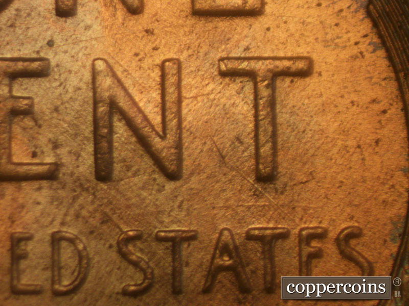 Die-stage B marker on 1957D•1MM•006 (1957 Repunched Mint Mark).