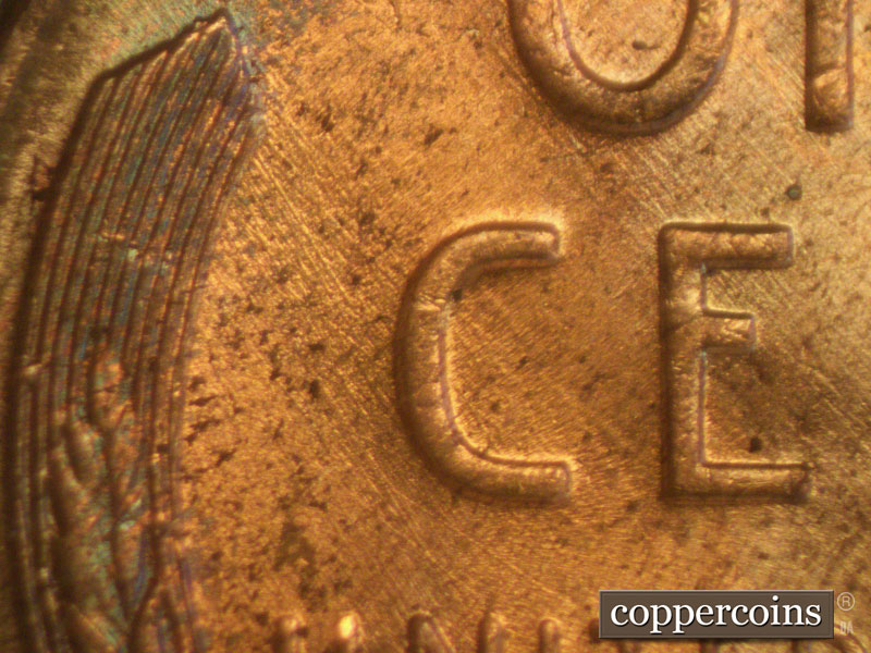 Die-stage B marker on 1957D•1MM•006 (1957 Repunched Mint Mark).