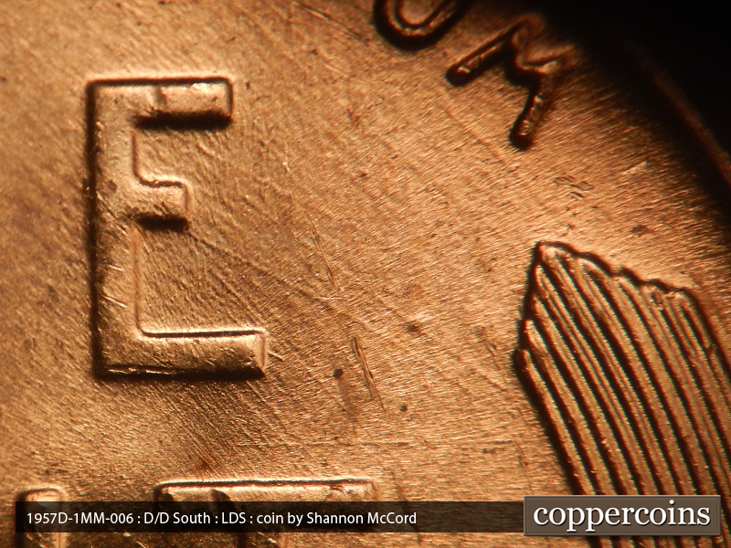 Die-stage C marker on 1957D•1MM•006 (1957 Repunched Mint Mark).