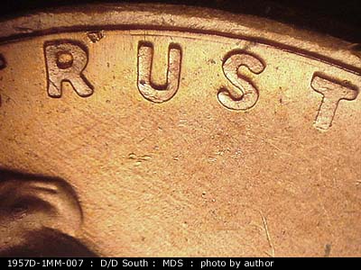 Die-stage B marker on 1957D•1MM•007 (1957 Repunched Mint Mark).