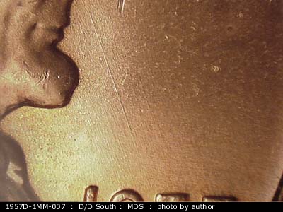 Die-stage B marker on 1957D•1MM•007 (1957 Repunched Mint Mark).