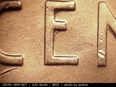 Die-stage B marker on 1957D•1MM•007 (1957 Repunched Mint Mark).
