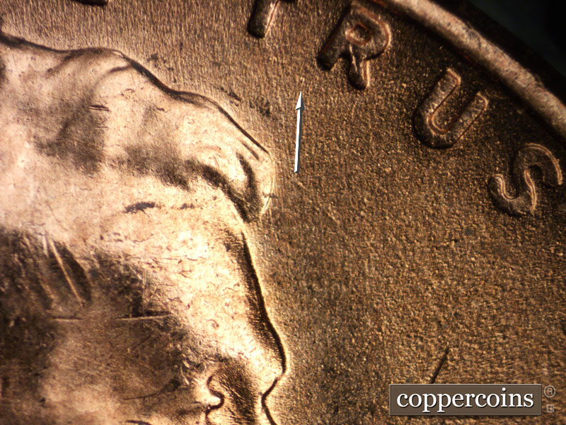 Die-stage B marker on 1957D•1MM•008 (1957 Repunched Mint Mark).