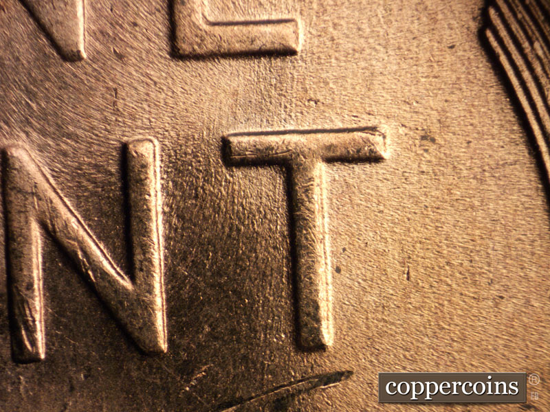 Die-stage B marker on 1957D•1MM•008 (1957 Repunched Mint Mark).
