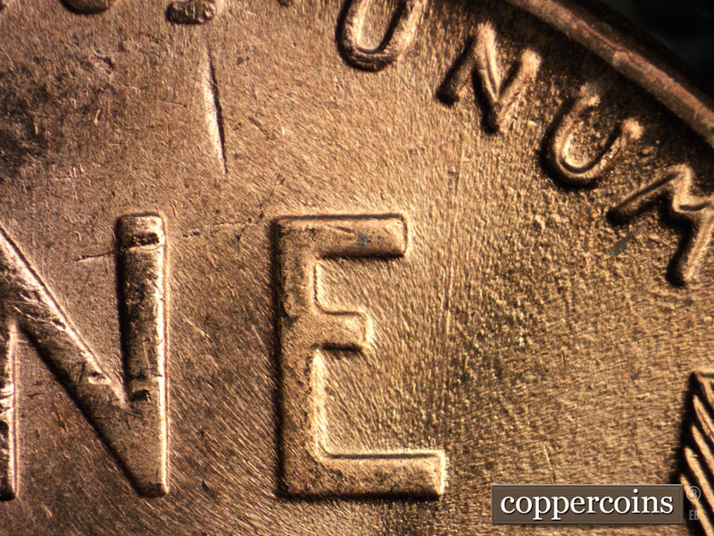 Die-stage B marker on 1957D•1MM•008 (1957 Repunched Mint Mark).