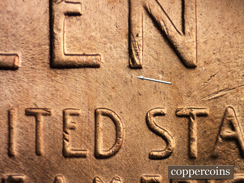 Die-stage B marker on 1957D•1MM•008 (1957 Repunched Mint Mark).