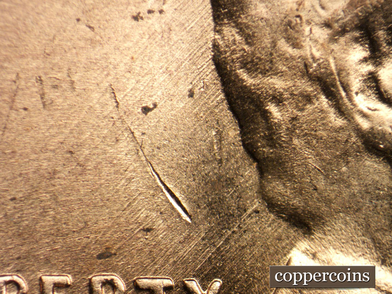 Die-stage C marker on 1957D•1MM•008 (1957 Repunched Mint Mark).