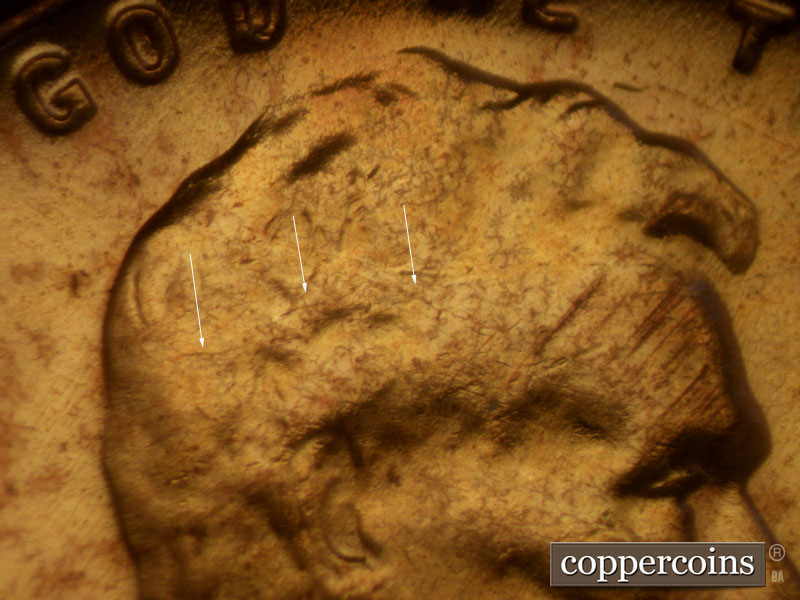 Die-stage B marker on 1957D•1MM•009 (1957 Repunched Mint Mark).