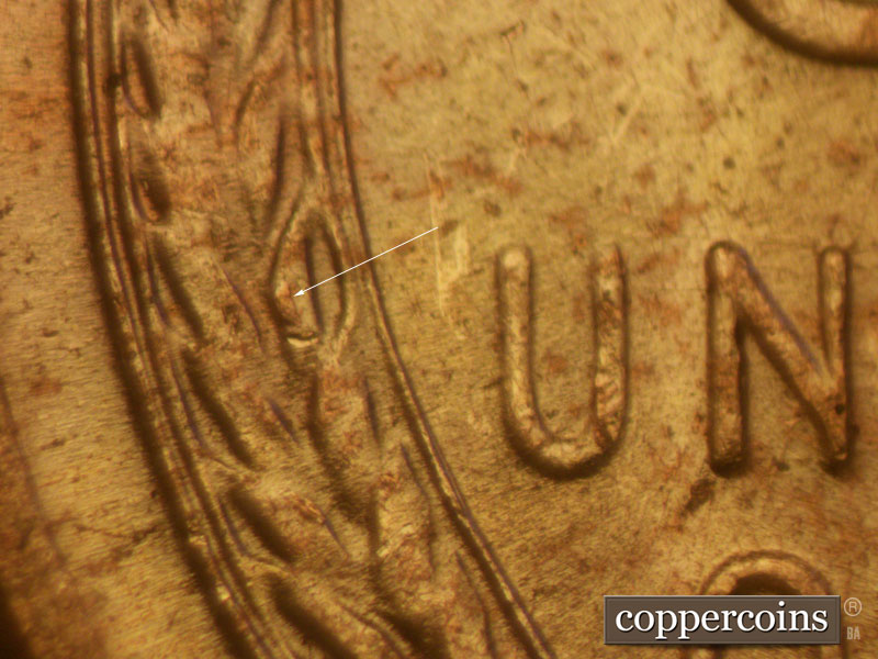 Die-stage B marker on 1957D•1MM•009 (1957 Repunched Mint Mark).
