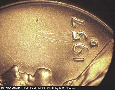 Die-stage B marker on 1957D•1MM•011 (1957 Repunched Mint Mark).