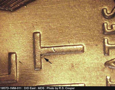 Die-stage B marker on 1957D•1MM•011 (1957 Repunched Mint Mark).