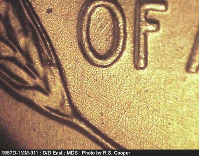 Die-stage B marker on 1957D•1MM•011 (1957 Repunched Mint Mark).