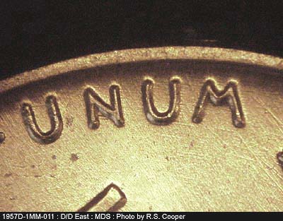 Die-stage B marker on 1957D•1MM•011 (1957 Repunched Mint Mark).