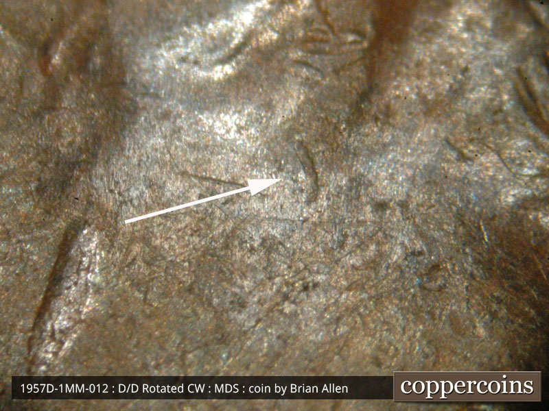 Die-stage B marker on 1957D•1MM•012 (1957 Repunched Mint Mark).