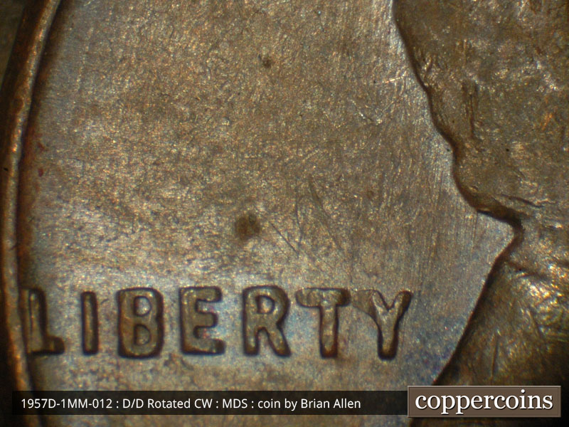 Die-stage B marker on 1957D•1MM•012 (1957 Repunched Mint Mark).