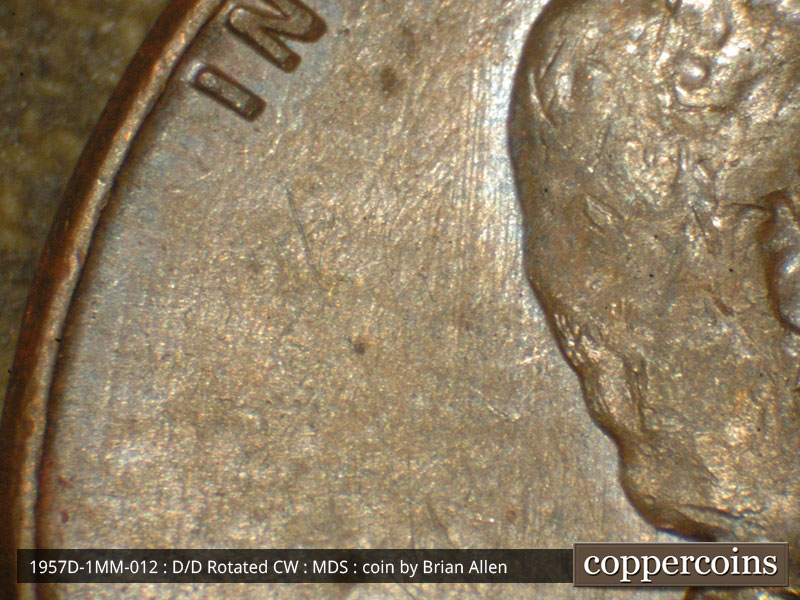 Die-stage B marker on 1957D•1MM•012 (1957 Repunched Mint Mark).